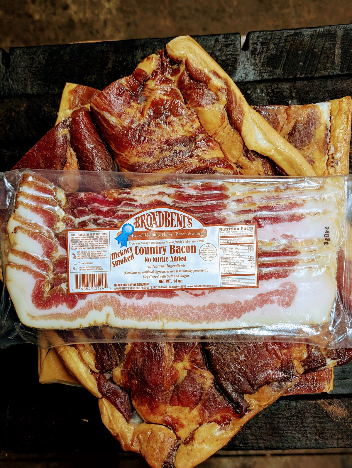 Broadbent's no nitrite added hickory smoked country bacon package on slabs of dry-cured bacon